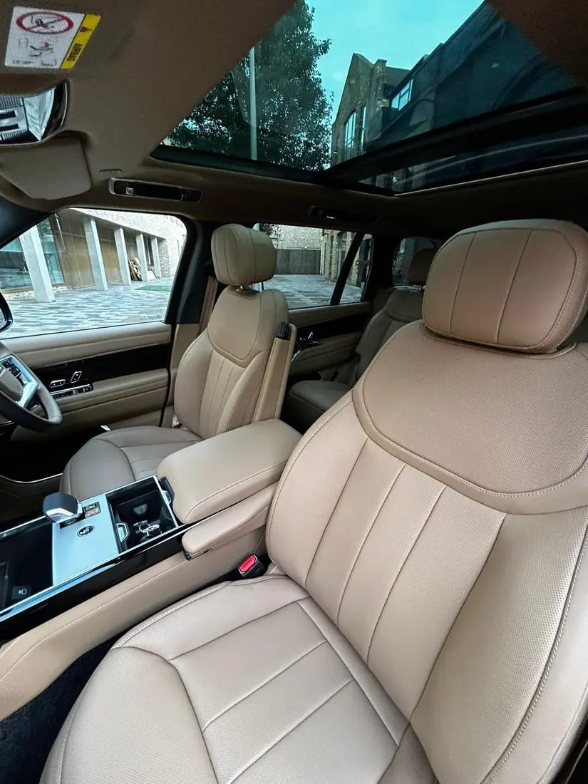 Cream leather rear seat and panoramic sunroof in the luxury SUV